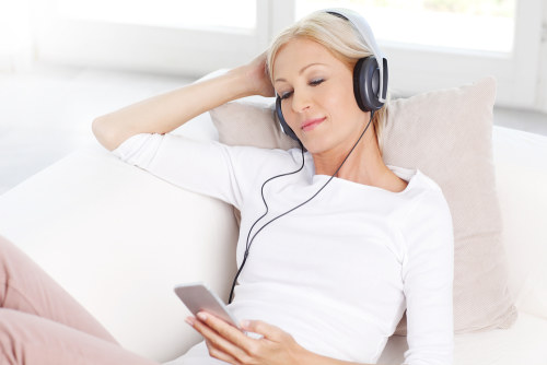 Woman listening to guided hypnosis healing meditation